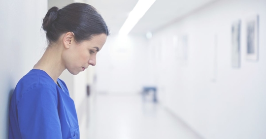 depressed looking nursing aid