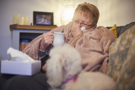 cold Elder with dog and blanket