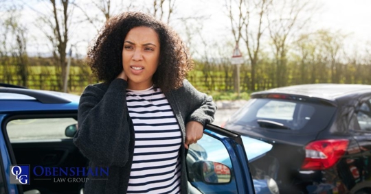 woman beside a car crash